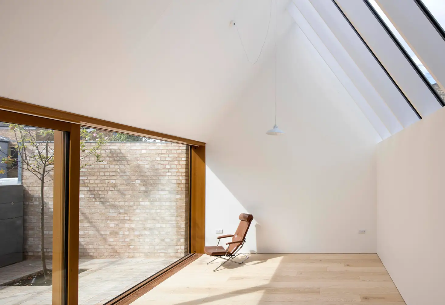 Vaulted roof extension interior with skylight and timber flooring