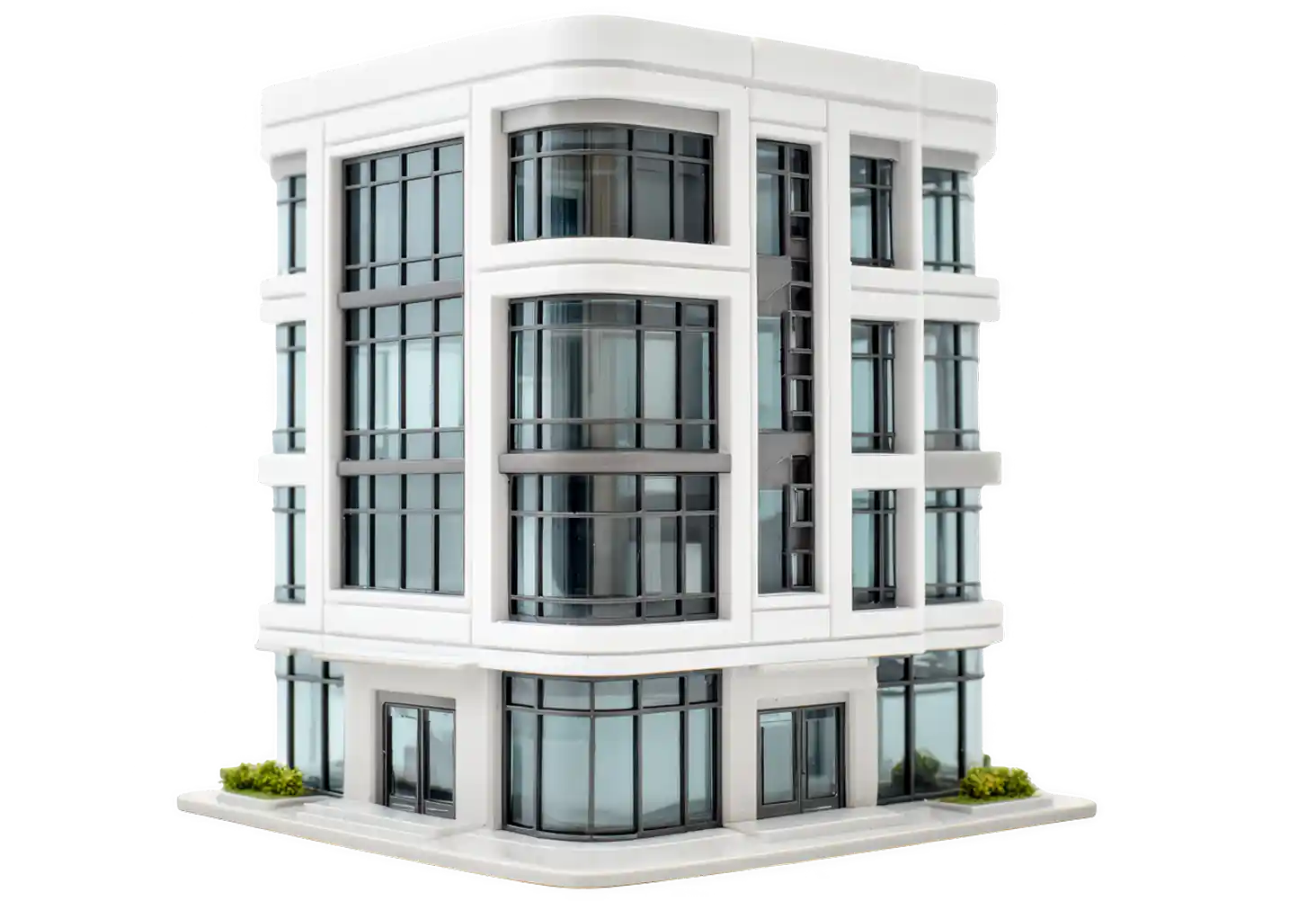 White corner building with curved bay windows and a glazed commercial ground floor